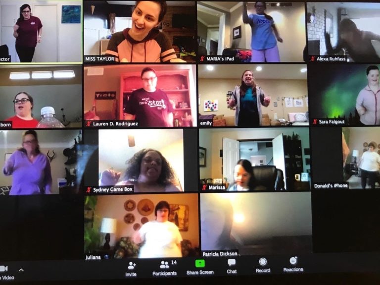 virtual zoom class screenshot with 14 video streams of people signing and dancing