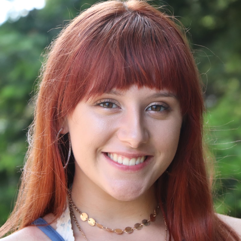 headshot of shelby eppich, red hair young woman smiling