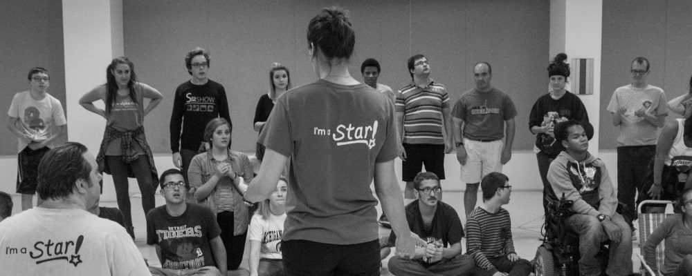 female instructor teaching in front of group of diverse students